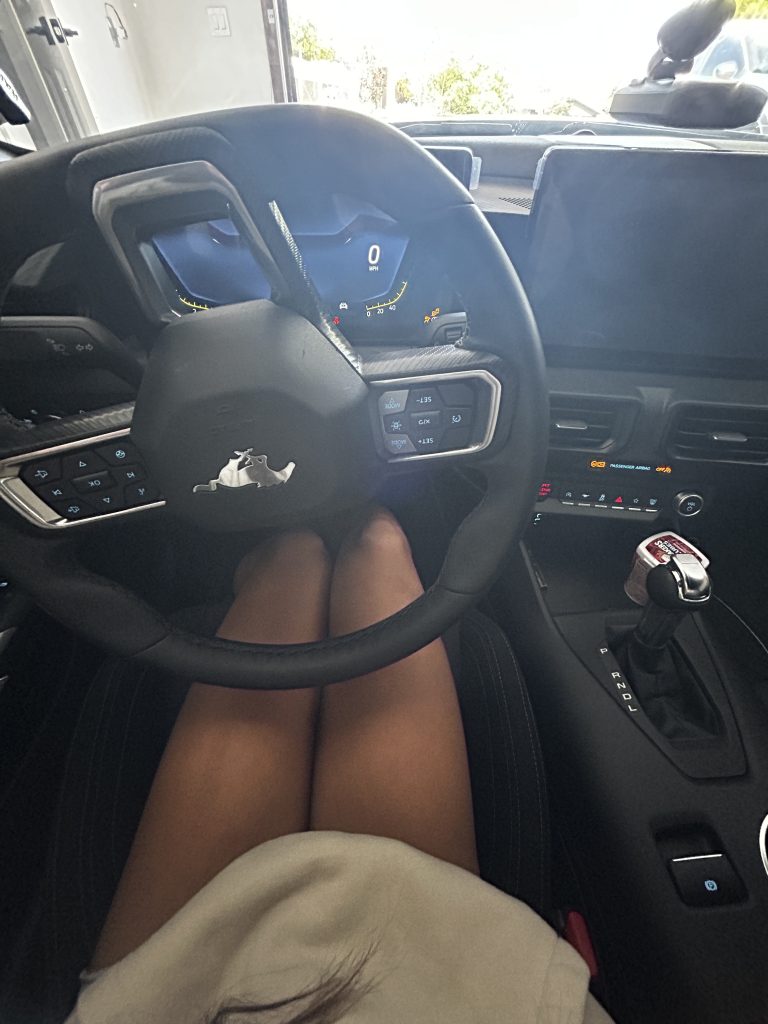 Behind the wheel of a 2024 Ford Mustang EcoBoost.